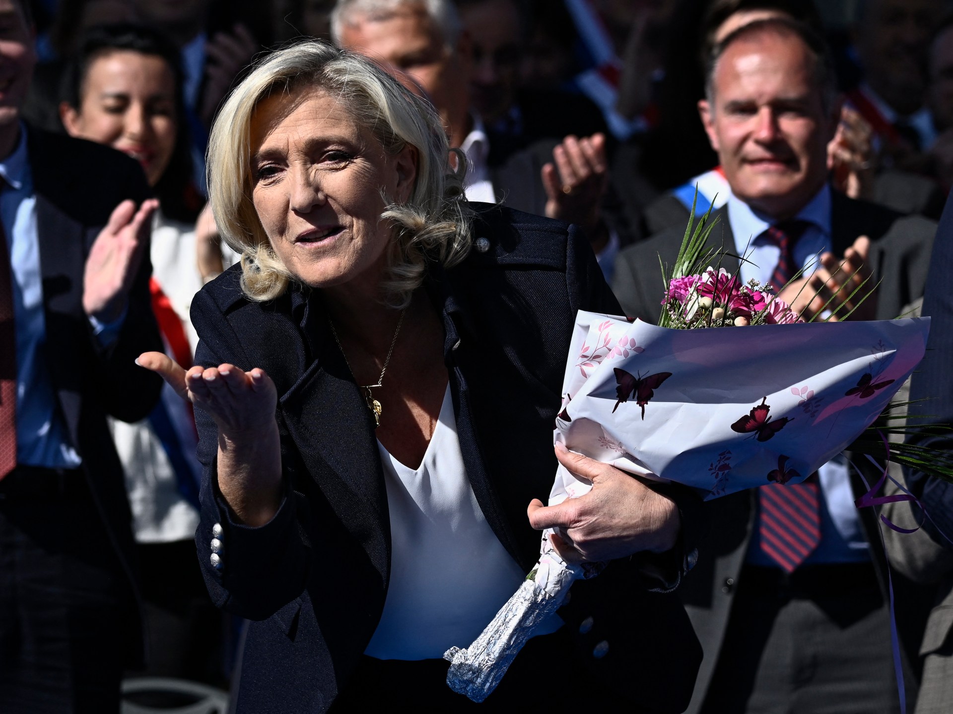 In duelling Paris rallies, Le Pen condemns ‘witch-hunt’, counterprotests