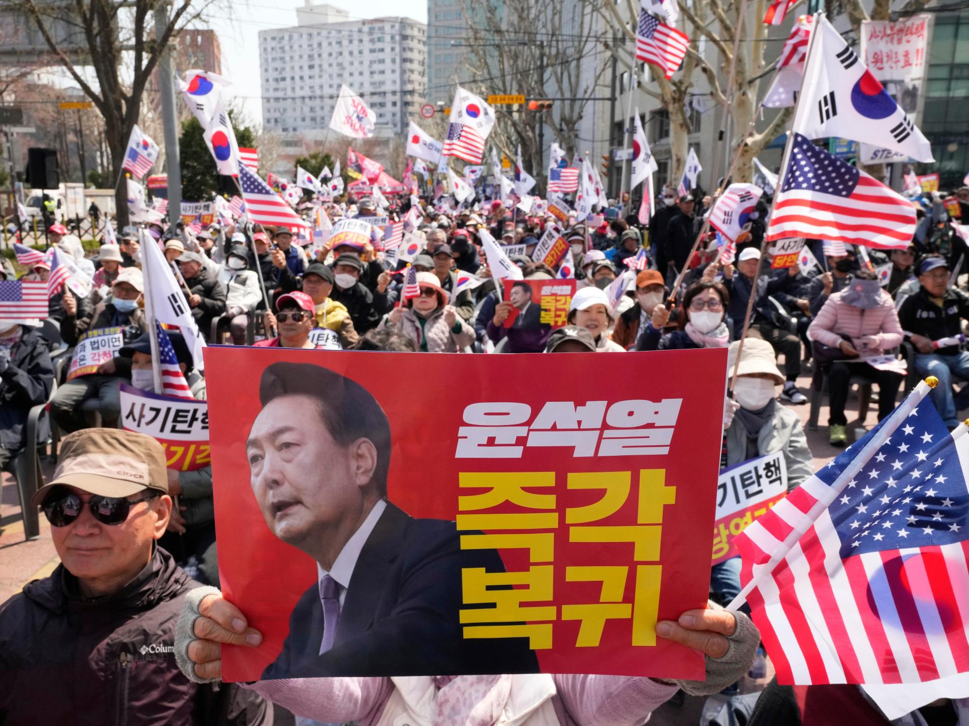 Downtown Seoul tense as court rules on President Yoon’s impeachment