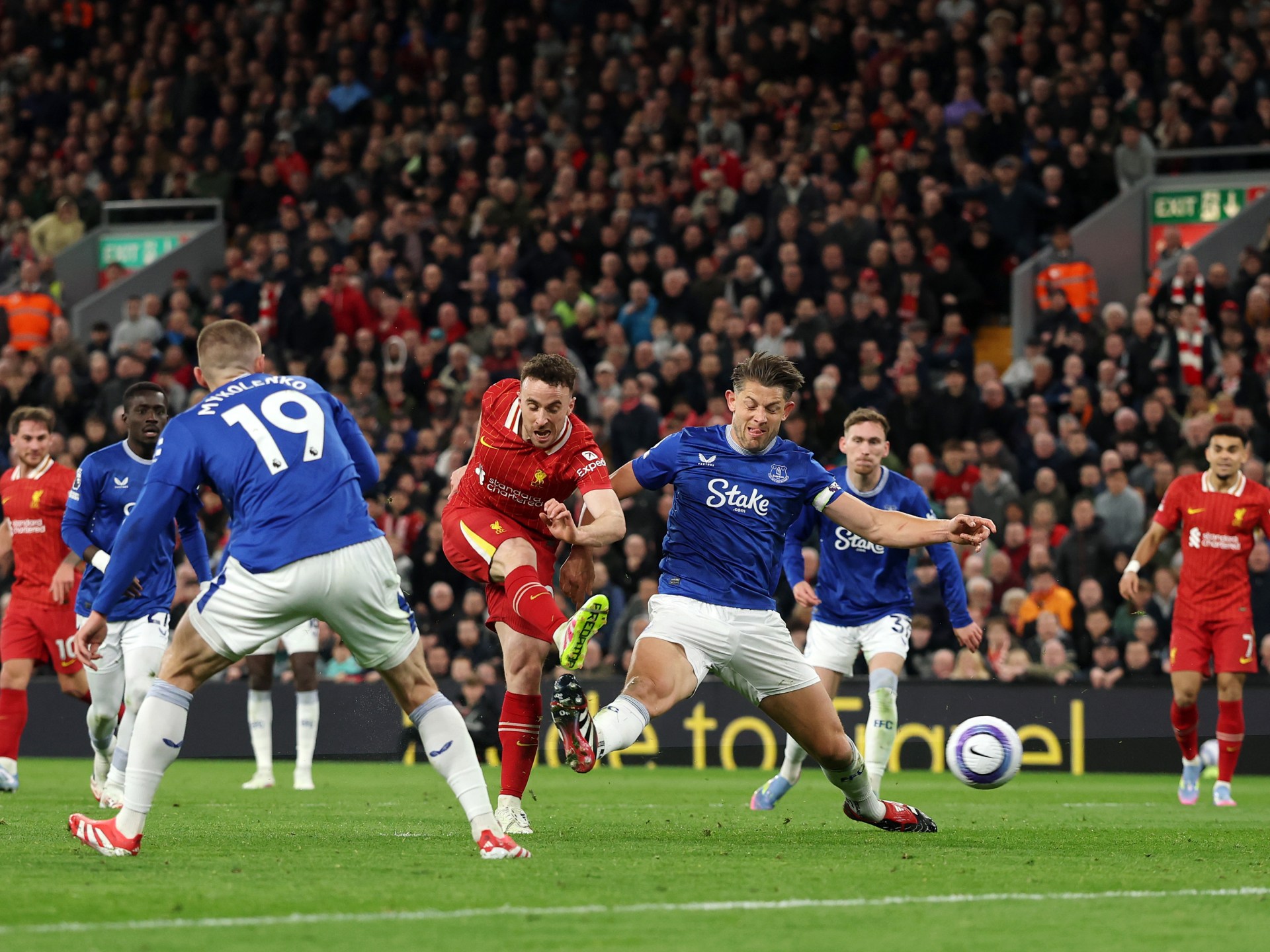 Liverpool beat Everton in feisty derby to keep title charge on track