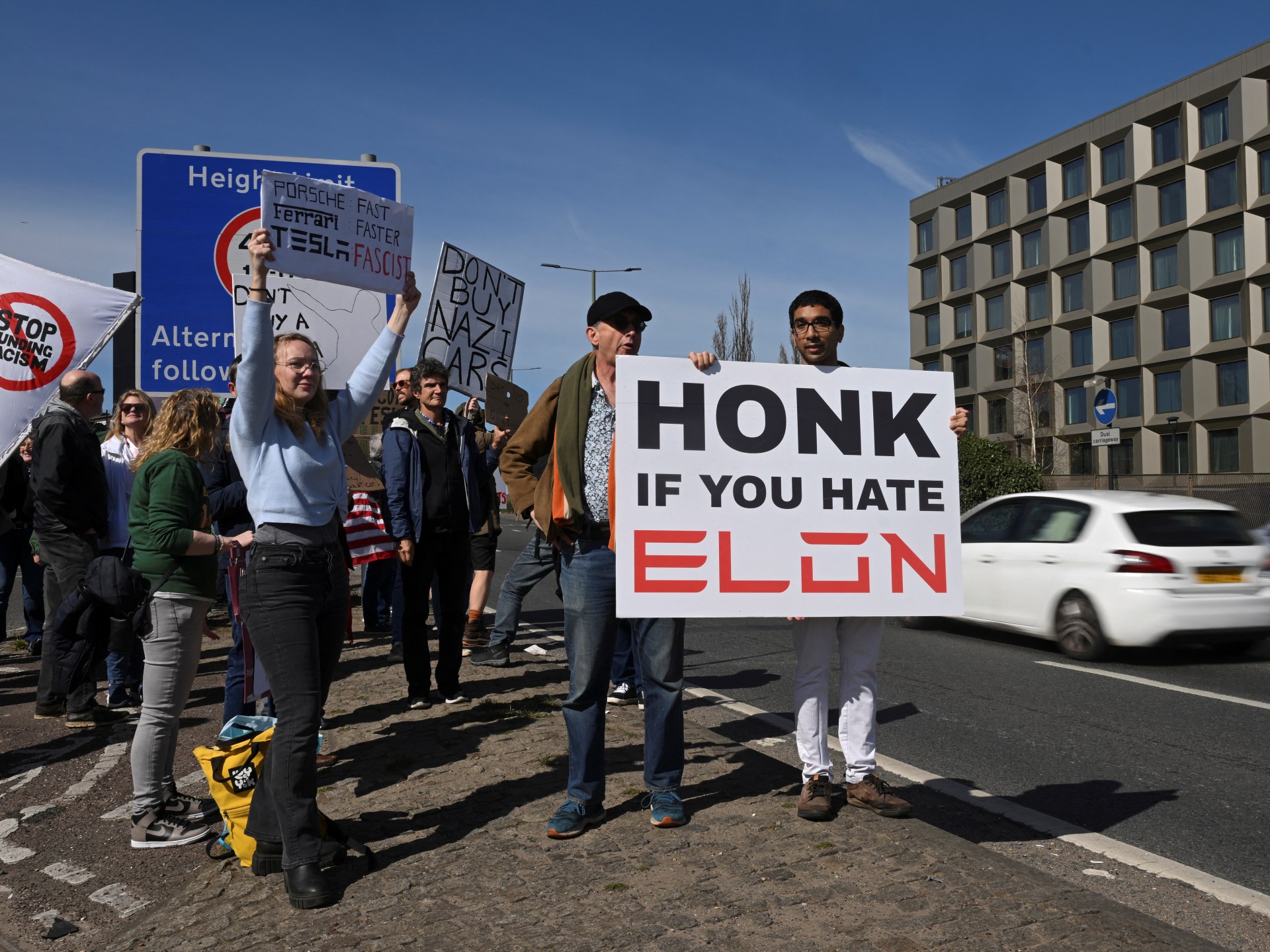 Elon Musk protesters gather at Tesla showrooms
