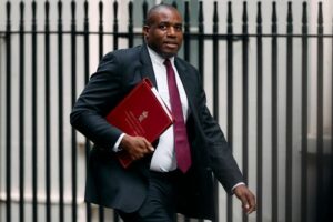 Why is the UK scaling back jury trials, and why is it controversial?