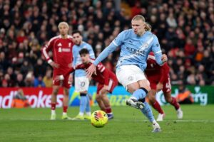 Man City fight back to win 2-1 at Liverpool and keep title hopes alive