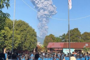 Indonesia volcano kills three as search for 20 missing hikers under way