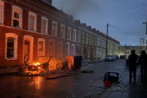 Protesters torch cars, buildings in Belfast after knife attack