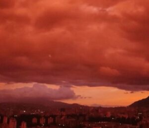 Venezuelan sky turns deep red as sun sets over Caracas