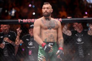 Injured Conor McGregor’s UFC comeback ends in defeat to Max Holloway