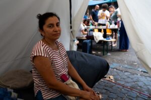 Hundreds camp on sweltering Rome street amid tussle over squatted building